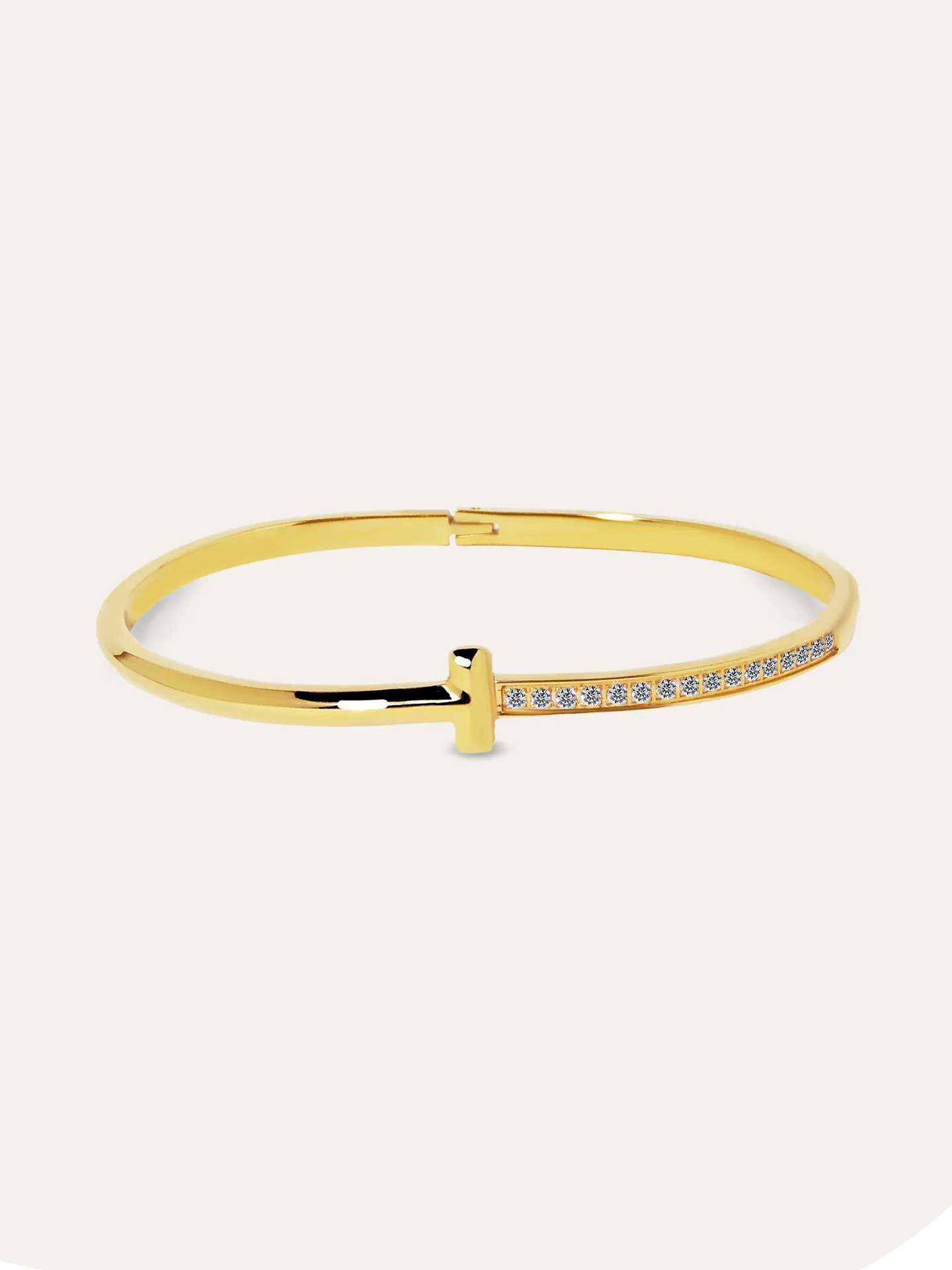 [A9010113] BARAZALETE "T" ZIRCONIAS BAÑO ORO